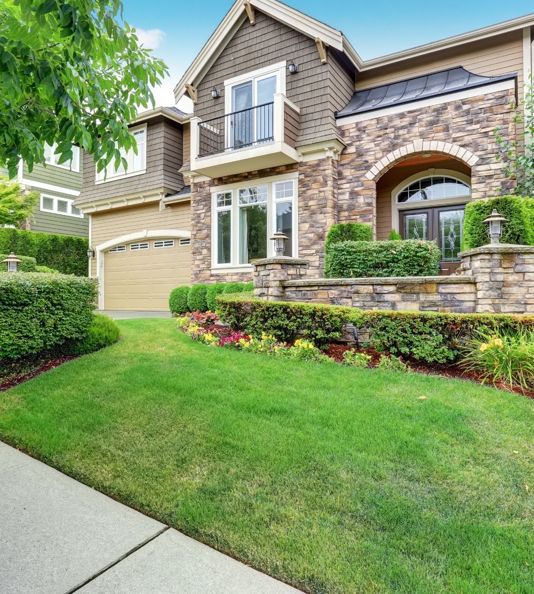 Beautiful curb appeal of American house with stone trim