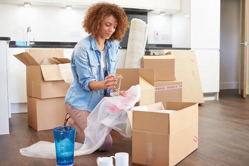 a woman moving into new home