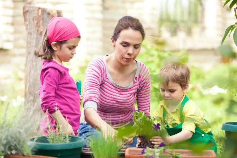 mother and kids gardening