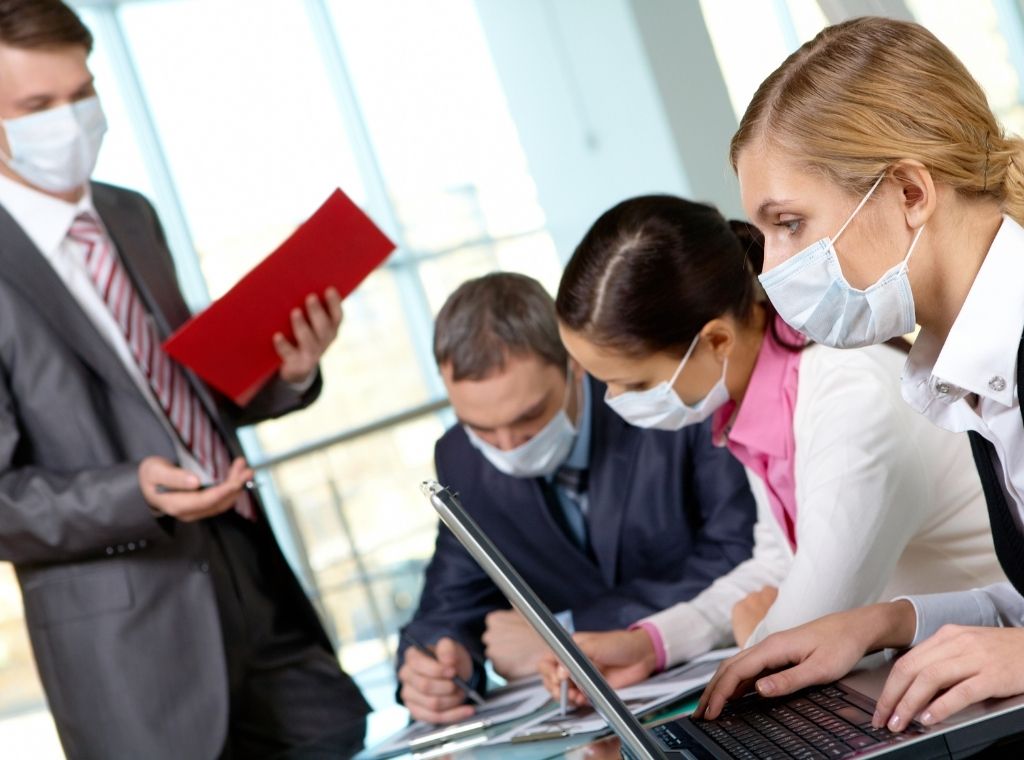 People wearing nose masks in the office