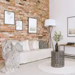 living room with brick wall