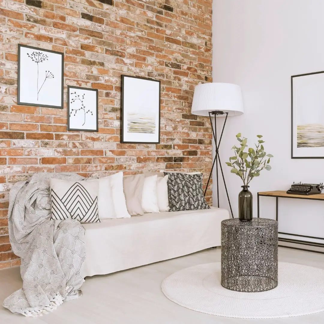 living room with brick wall - add an artistic feel to your decor