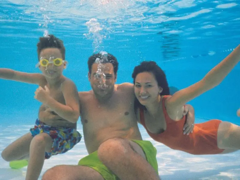 family having fun in pool