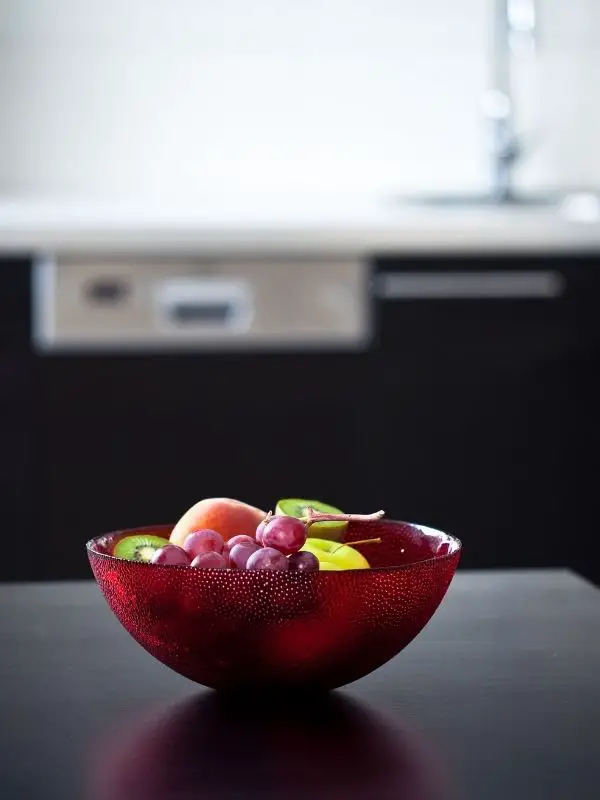 fruits in a large bowl on a kitchen island