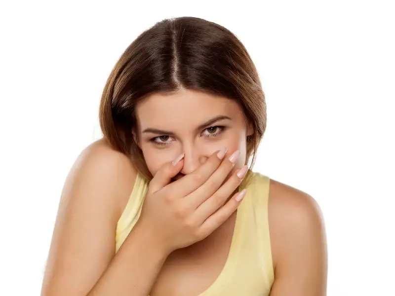 shy woman, smiling and covering her mouth