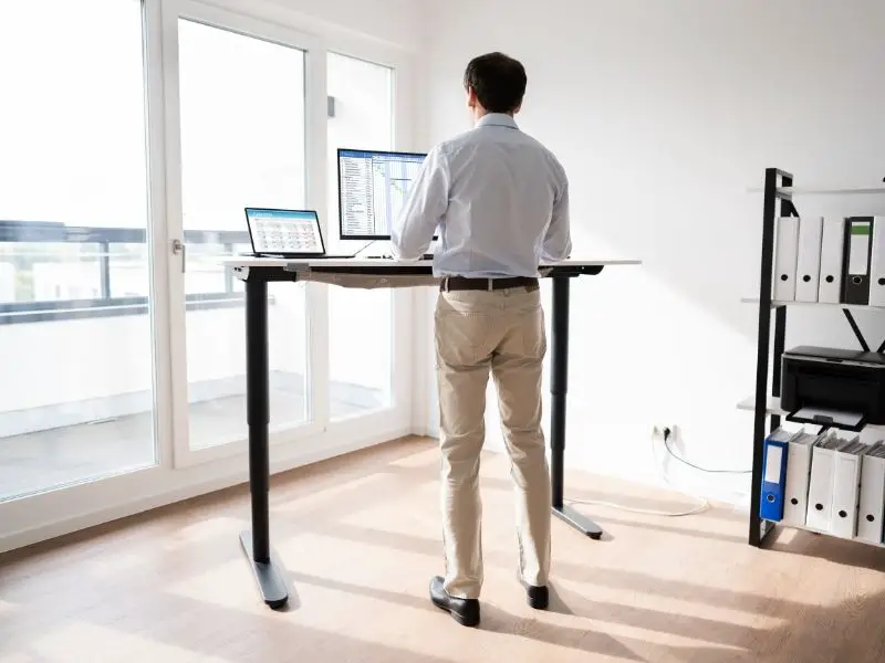 man standing at a desk