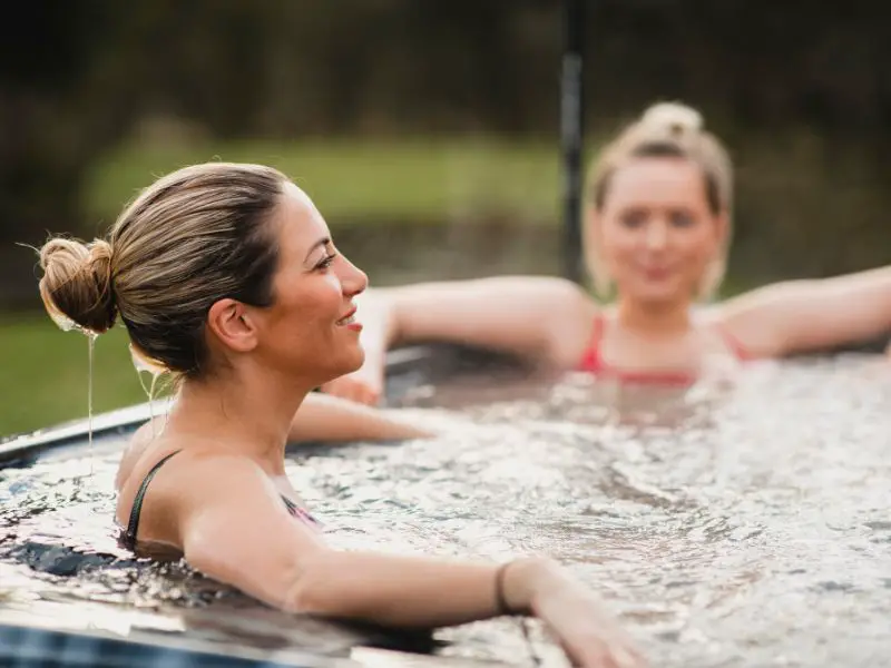 friends relaxing in a hot tub